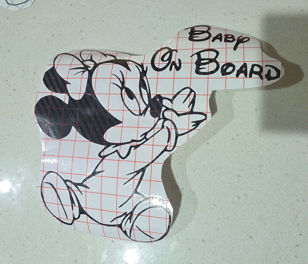 Minnie-inspired baby on board decal on car window, weather-resistant vinyl design