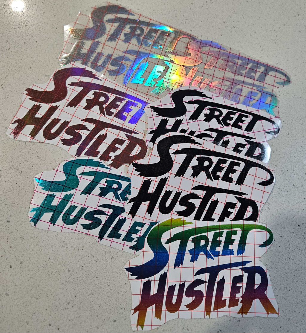 Street Hustler decal sticker on car window, bold and weather-resistant design for outdoor use