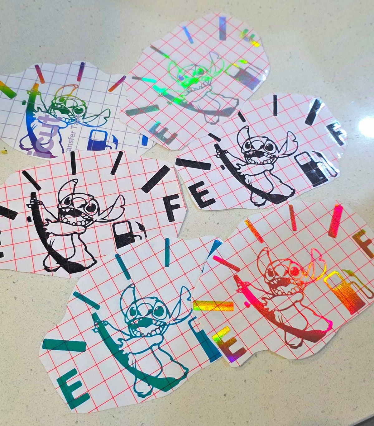 Stitch Fuel decal with playful character design on car window in holographic finish