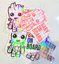 Baby Groot Baby On Board decal on a car window, weather-resistant and made from premium vinyl